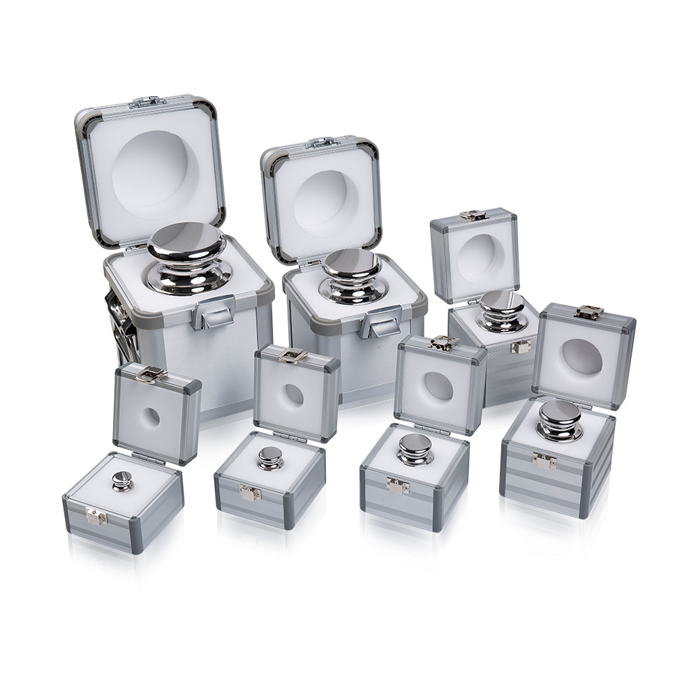 How do the materials of laboratory calibration weights minimize external influences?